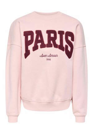 Sweat-shirt rose clair à col rond avec un grand texte "PARIS" en rouge foncé, et en dessous, en plus petit, "Avec Amour" et "1986" sur le devant.
