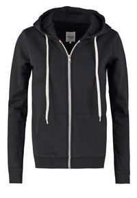 Sudadera con capucha negra con cremallera, textura suave, cordones en beige claro, bolsillos delanteros y puños y dobladillo acanalados. La etiqueta muestra "zalando."