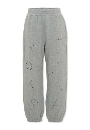 Grijze joggingbroek met elastische tailleband en boorden, voorzien van patronen van ronde oogjes die abstracte vormen en letters vormen.