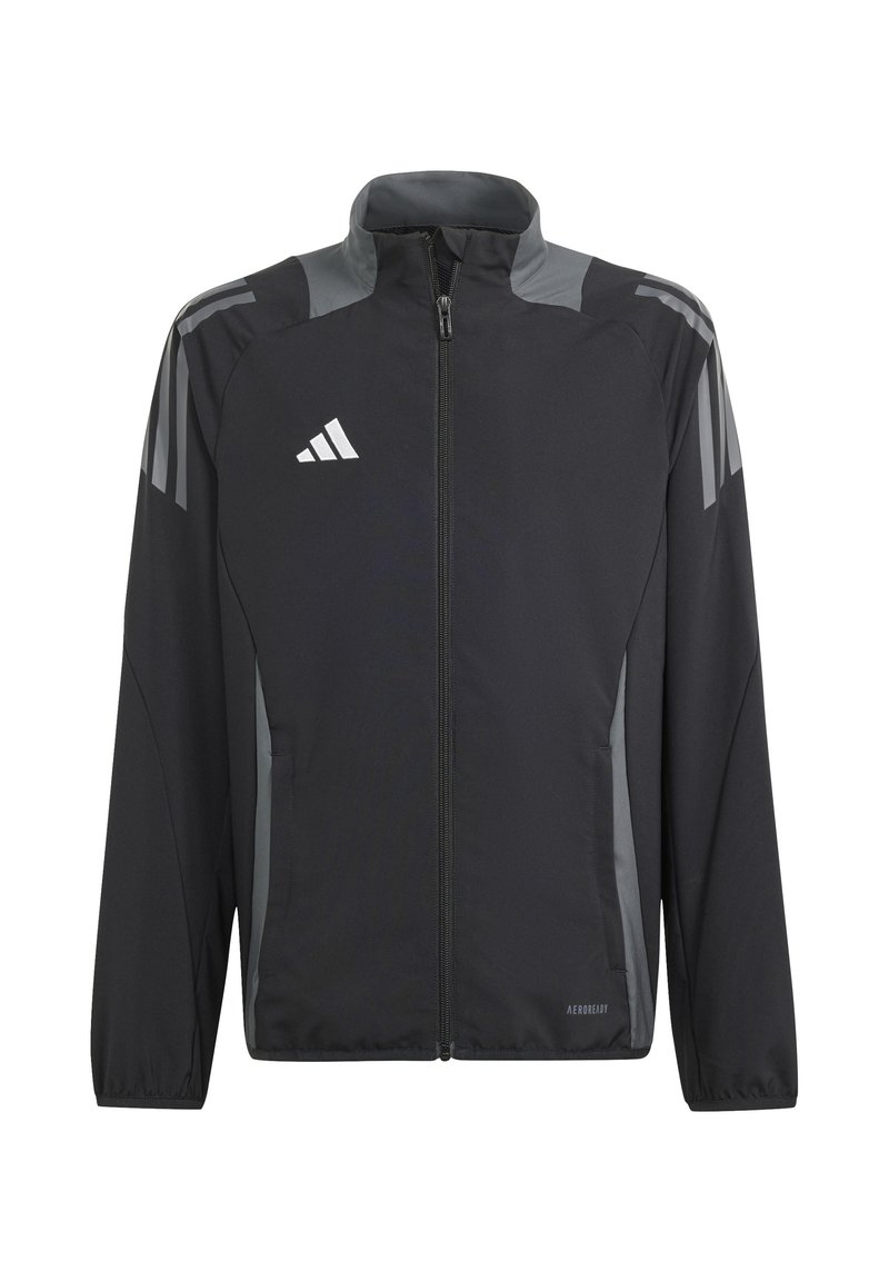 Veste de sport noire en matériau léger, avec un col montant, des accents gris, une fermeture éclair et des poches latérales. Logo Adidas affiché.