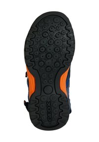 Semelle en caoutchouc noir avec des motifs circulaires et des accents orange. Présente des bords renforcés et le logo Geox. Texturée pour une meilleure adhérence et durabilité.