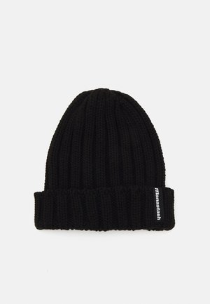 Černá pletená čepice s vroubkovanou struktura a složeným lemem. Obsahuje malou bílou nášivku s logem na boku.