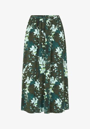 Gonna lunga con vita elastica, realizzata in tessuto leggero con motivo floreale verde e bianco su fondo scuro.