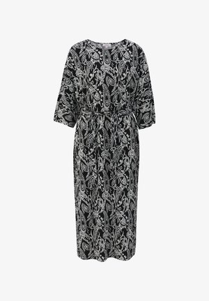 Robe imprimée paisley en noir et blanc avec des manches courtes en batwing, une taille cintrée et une silhouette fluide. Fabriquée en tissu léger.