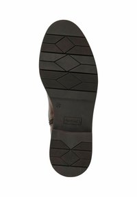 Brązowy skórzany but z teksturowaną gumową podeszwą z diagonalnymi rowkami i diamentowym wzorem dla lepszej przyczepności. Zamek błyskawiczny po boku.