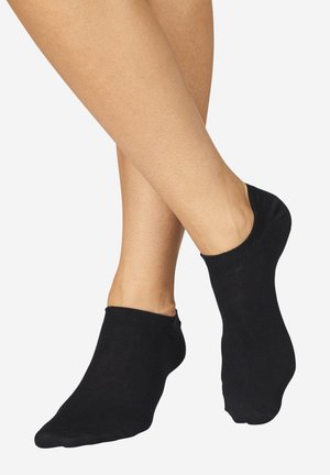Black ankle socks with a soft texture, featuring a low-cut design that sits below the ankle. Simple, seamless construction.