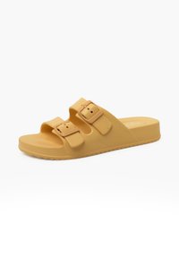 Yellow rubber slide sandal with two adjustable buckle straps, textured surface, and a flat sole featuring a ridged pattern for traction.