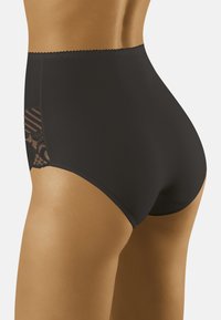 Hoge taille zwarte panties van gladde stof, met een kantpaneel met gestreept detail aan de zijkant. Scalloped tailleband rand.
