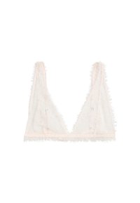 Sheer white lace bralette with thin straps, featuring delicate floral patterns and fringed edges on a plain background.