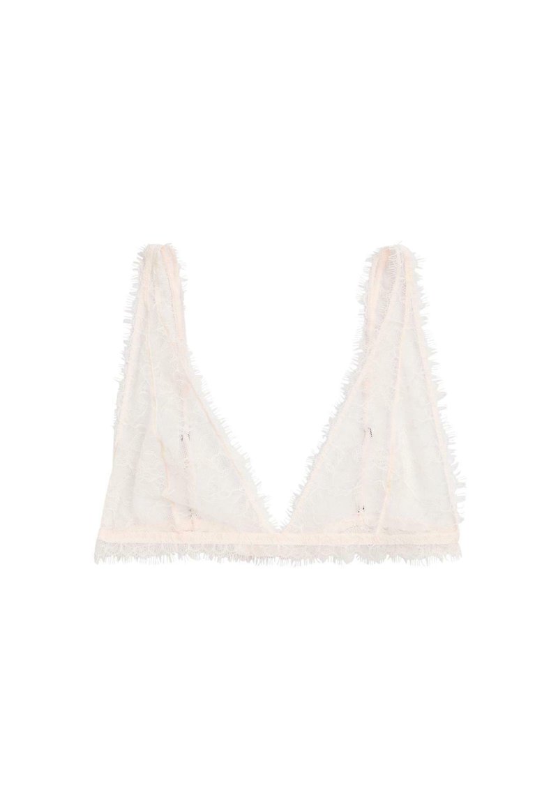 Sheer white lace bralette with thin straps, featuring delicate floral patterns and fringed edges on a plain background.