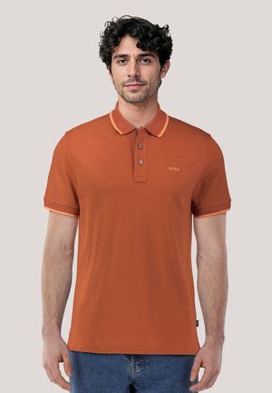 Orange polo shirt with a two-button placket, contrasted collar and sleeve cuffs. Features small logo on the chest. Cotton blend fabric.