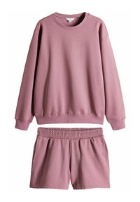 Ružový bavlnený sweatshirt s voľným strihom a rebrovanými manžetami, skombinovaný s rovnakými šortkami s elastickým pásom a bočnými vreckami.