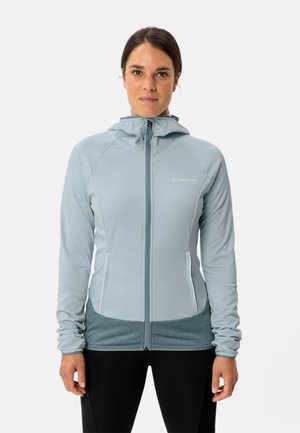 Lichtblauwe ritsjack met een aansluitend ontwerp, capuchon en textielstof. Beschikt over contrasterende donkerblauwe accenten langs de zoom en zakken.