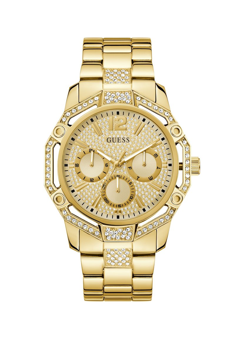 Montre en acier inoxydable doré avec un cadran texturé et étincelant, trois sous-cadrans, et des accents en cristal sur la lunette et le bracelet. Boîtier de forme octagonale.