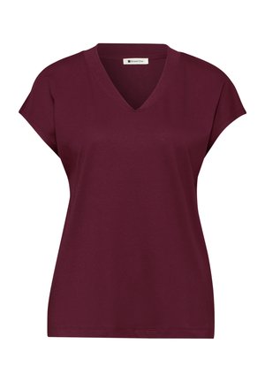 Top burdeos de manga corta con escote en V, ajuste relajado y pequeñas mangas tipo capa en los hombros, vista frontal.