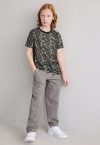 Puma TAD TEE UNISEX - Αθλητικό μπλουζάκι - black