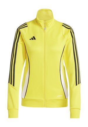 Veste zippée jaune en tissu lisse avec des rayures noires sur les manches et des accents blancs sur les côtés. Présente un col montant.
