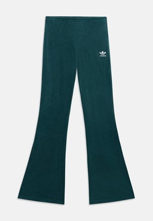 Velvet flared pants in dark teal, featuring a smooth texture, elastic waistband, and a white Adidas logo on the upper left side.