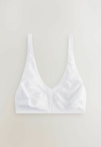Bralette blanco sin costuras con un diseño de escote en V profundo, tirantes ajustables y una textura suave y lisa. Sin broches ni relleno visibles.