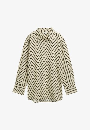 Dolga majica z dolgimi rokavi v kremni barvi z črnim cik-cak vzorcem, z običajnim ovratnikom, gumbnim zapiranjem in sproščenim krojem. Mehka teksturirana tkanina.