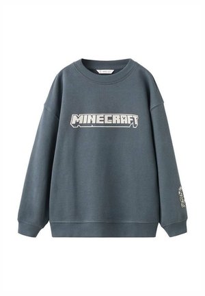 Sweatshirt bleu clair-gris en tissu doux, avec un grand motif "MINECRAFT" sur le devant et un accent à motif sur la manche.