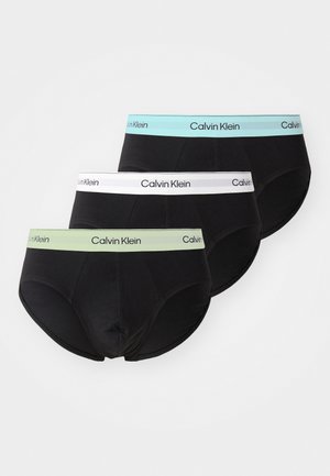 Três pares de boxers pretos de algodão com cinturas elásticas em verde claro, branco e azul claro, apresentando a marca "Calvin Klein".