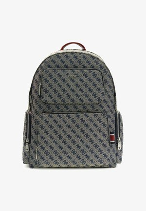 Backpack with navy blue patterned fabric, two front zippered pockets, side pouches, red and navy striped detail, and a top handle.