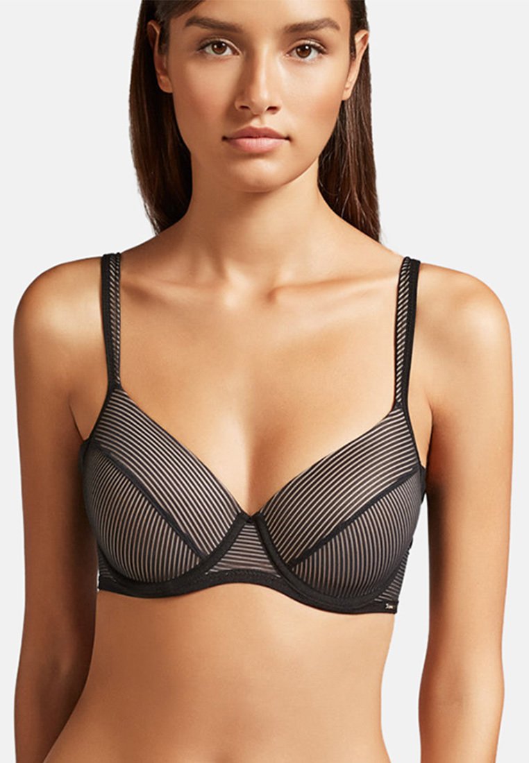 Black striped bra with sheer material. Features underwire support and adjustable straps. Vertical lines create a textured pattern.