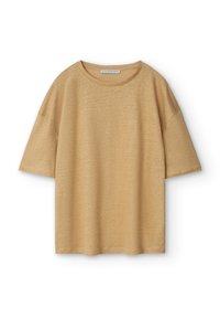 Beige kortärmad oversized T-shirt med rund halsringning och liten logo på nedre vänstra fållen.
