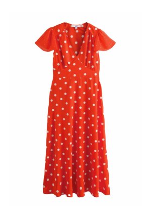 Red polka dot dress with a wrap design, short flutter sleeves, and a flowy skirt. Made from soft fabric with white, evenly spaced dots.