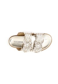 Metallic gold slide sandal with two woven straps, embellished with clear rhinestones. Flat sole with a smooth texture and open design.