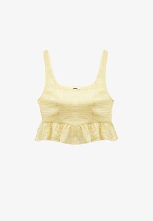 Gul crop top med et struktureret mønster, firkantet halsudskæring, brede stropper og en flæsekanter. Blomsterdesign prægede hele vejen igennem.