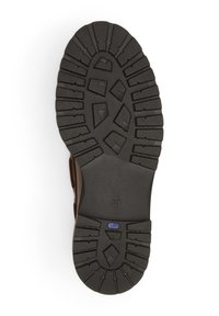 Semelle en caoutchouc avec des motifs hexagonaux et des rainures profondes, accentuée par du silicone marron. Taille marquée 37, renforcée pour une meilleure adhérence.