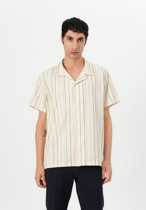 Short-sleeved button-up shirt in cream with green and peach vertical stripes; relaxed fit, soft texture, notched collar, and front button closure.