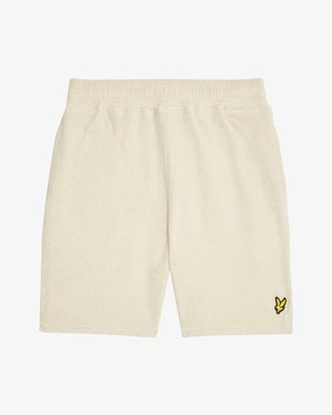 Cremefarbene Frotteeshorts mit elastischem Bund und kleinem gelb-schwarzem Vogel-Logo am unteren linken Bein.