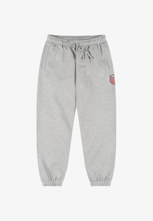 Szare spodnie dresowe wykonane z miękkiego materiału, z elastycznym pasem ze sznurkiem, bocznymi kieszeniami oraz naszywką z logo na lewej stronie biodra.