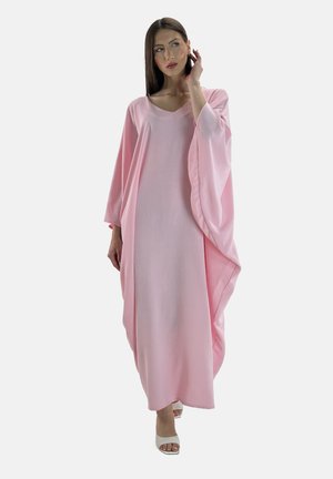 Light pink kaftan with a loose fit, long sleeves, and a deep V-neck. Soft, textured fabric with draped detailing along the sides.