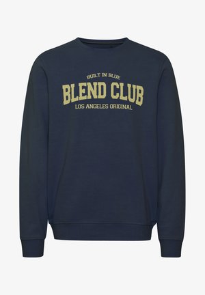 Felpa blu scuro con collo rotondo, maniche lunghe e polsini a costine. Presenta una grande grafica in giallo con la scritta "BLEND CLUB LOS ANGELES ORIGINAL."
