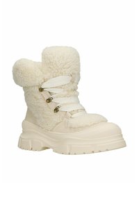 Stevige crèmekleurige laarzen met een zachte, gestructureerde bovenzijde en gladde accenten. Voorzien van witte veters en een dikke, geprofileerde zool voor grip.