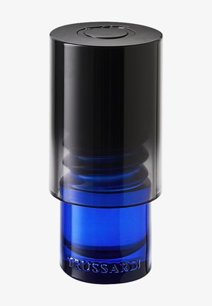 Cylindrical blue glass bottle with black translucent cap, embossed with "TRUSSARDI" on the base, standing upright on a white background.