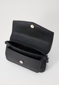 Black leather handbag with a textured finish, featuring a gold-tone snap closure and two compartments, designed with a simple silhouette.