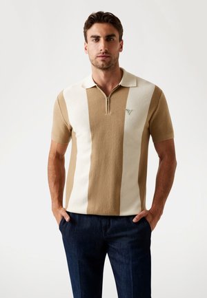 Knit polo shirt featuring alternating light brown and cream stripes, zippered collar, short sleeves, and a small logo on the chest.