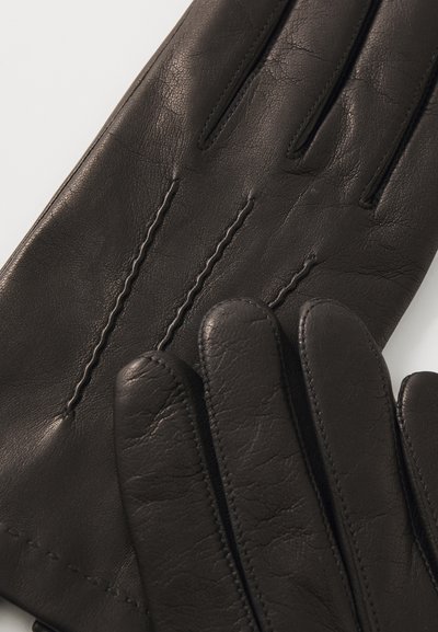 Gants en cuir noir avec trois lignes cousues à l'arrière. Texture lisse, forme ajustée et bouts des doigts arrondis pour le confort et la flexibilité.
