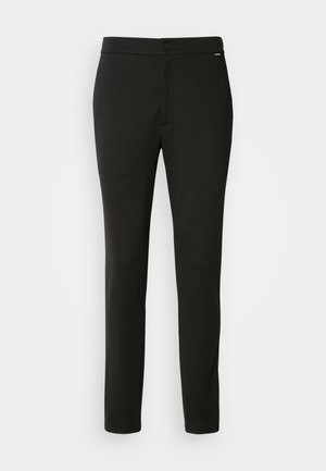 Calvin Klein COMFORT TAPERED - Vászonnadrágok - black
