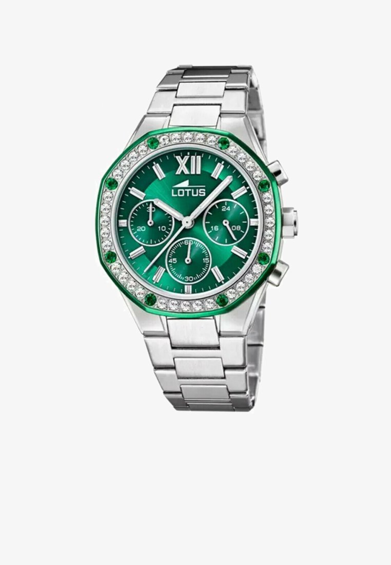 Orologio in metallo argentato con quadrante verde, dettagli in cristallo e lunetta ottagonale con particolari verdi. Tre sottodial e marcatori luminosi.