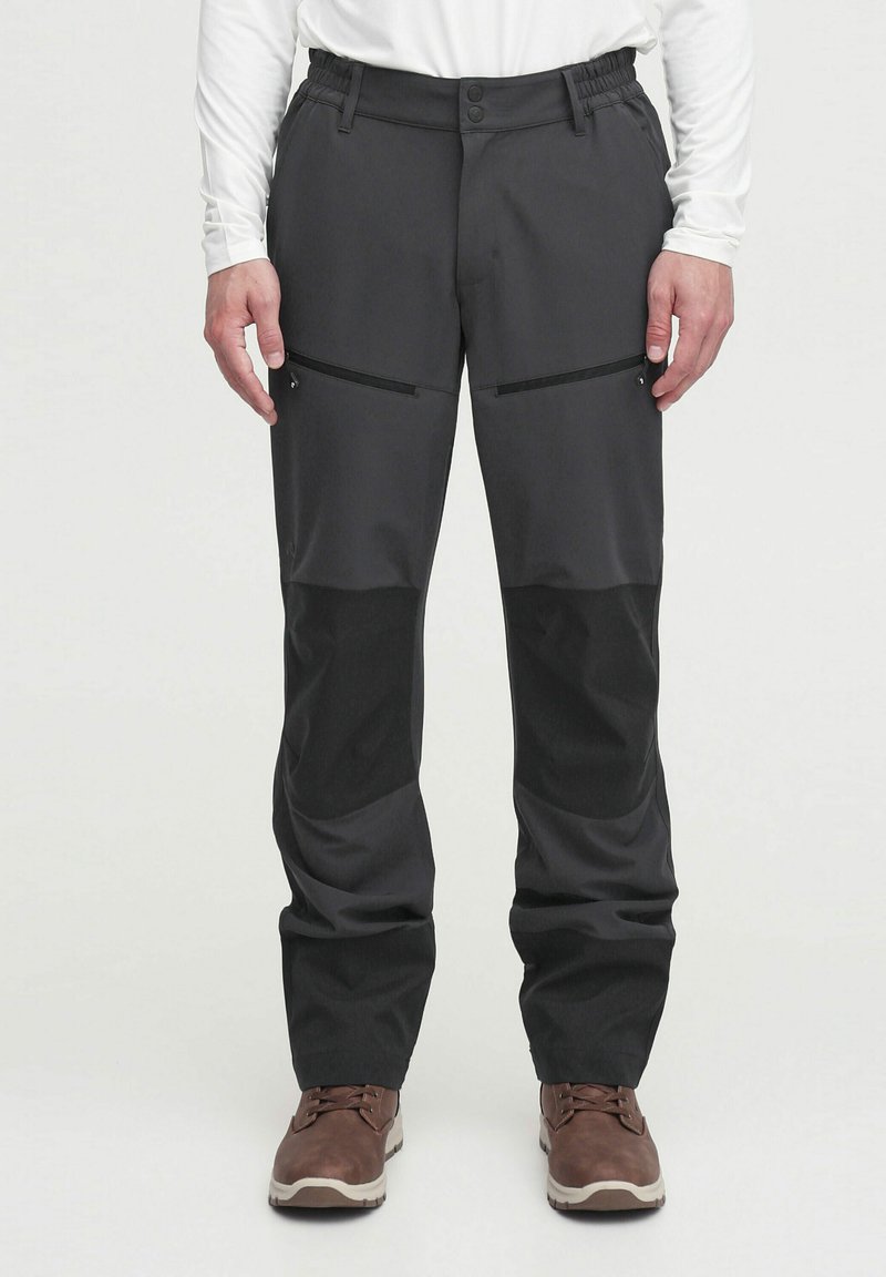 Black outdoor pants with a smooth texture, featuring two zippered front pockets and contrasting panels on the lower legs.