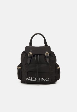 Black Valentino backpack with top handle, front flap with buckles, drawstring closure, side zip pockets, and large front pocket with logo.