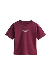 Bordo bomba majica s kratkimi rokavi, okroglim izrezom in belim napisom "UNLIMITED SMILES EVERYDAY" na sprednji strani.