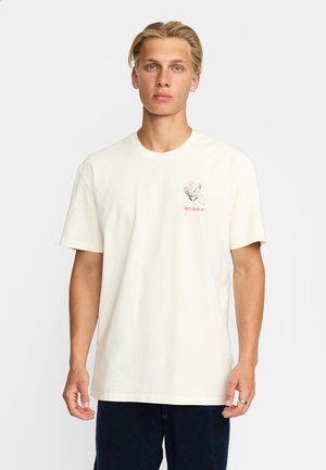 Crème-kleurige katoenen t-shirt met korte mouwen, ronde hals en een grafische afdruk van een haan met daaronder het woord "Revolutie".
