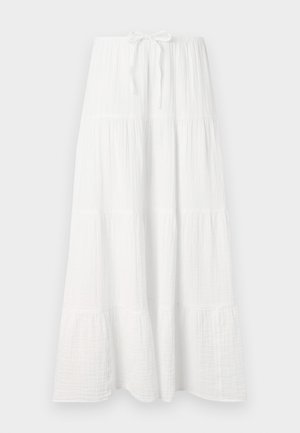 White long skirt made of textured fabric, featuring horizontal tiers and an adjustable waist tie for fit. Smooth, flowing design.